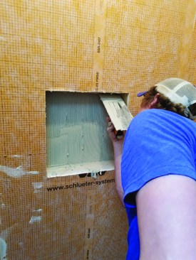 We then apply thinset to the entire opening and are ready to install the precut, prefolded sheet.