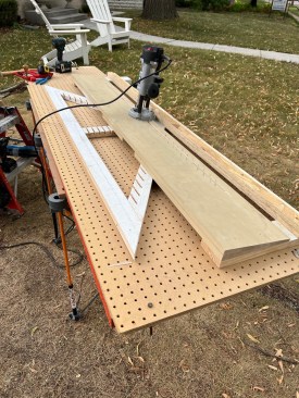 The top of the jig is made from two layers of beveled siding that position a plunge router at an angle.