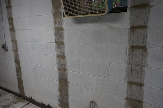 The wall surface ready for installing the carbon-fiber strapping.