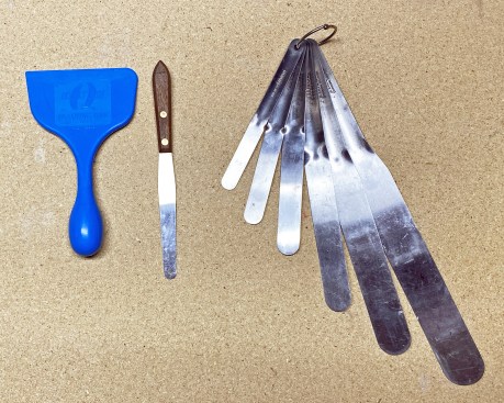 For tooling a joint, almost anything with a smooth, curved edge will work. The author likes the blue plastic flashing tool (shown at left in the photo above). Also shown (center and right) are a single spatula and a spatula set, both from Albion.