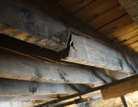 A partition wall, which sits directly above these damaged first-floor joists, was not designed to bear the added loads imposed by an underbuilt roof.