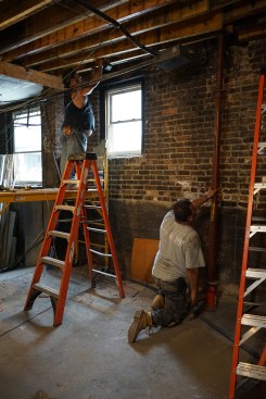With one end of the LVL sister bearing on a beam or ledger, the opposite end is jacked up to align with the bottom of the existing joist.