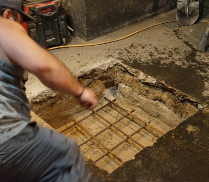 Chairs —called “bolsters” in the Midwest—keep the rebar grid in the footing elevated, allowing concrete to flow up the repar. Rebar is used to add tension strength to the concrete, and is placed in the bottom section of the footing where the tension forces will be greatest when the column is loaded.