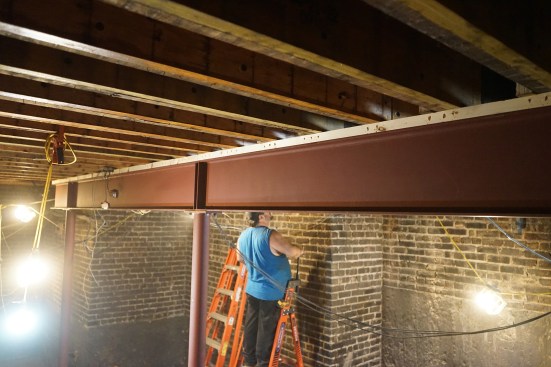 The far end of the second beam cantilevers beyond the far column. Above each column, stiffening plates have been applied by the beam fabricator to ensure loads transfer to the column.