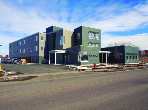 A view of the completed Elm Place project, with administrative and common areas near the street and apartments to the rear, above the parking garage. The building reached Passive House certification at an upcharge of about 2% from the client’s earlier Wright House project.