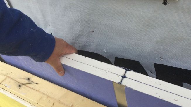 Two one-inch layers of gypsum board are rated to provide two hours of fire protection for buildings on either side, if the other side should catch fire. The H-stud holds the gypsum board in place.