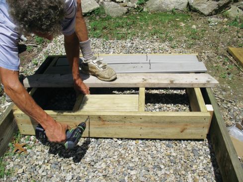 Double blocking is stronger than single blocking, and screws hold better than nails. The author attached two blocks to the rim, joists, and vertical block (not yet installed) using four screws per block per side. Blocking installed parallel to the rim joist, as shown, tended to split along the bolt line unless a heavy steel reinforcing plate was used. 