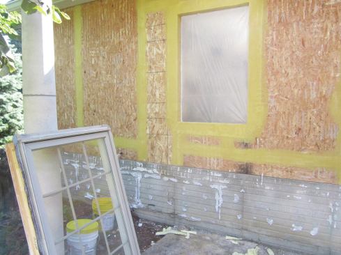 When applying a liquid waterproofing membrane over OSB or plywood sheathing, start by sealing the panel joints with a sandwich of fiberglass mesh and the liquid membrane.