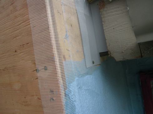 Here's another example of an outside corner being sealed with liquid membrane and mesh, followed by another layer of liquid membrane.