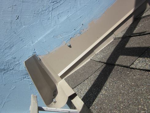 At the roof's bottom edge, sidewall flashing must terminate with a kickout to deflect water away from the sidewall and into a gutter. Large, preformed kickouts are preferred for steep roofs.