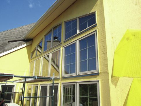 After the liquid WRB is applied, windows and doors are installed. Apply mesh and liquid WRB to the nail fins on the head and side jambs, but leave the sills open to allow water to drain out.           