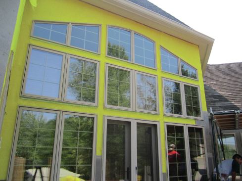 Again, the sills are left open while the side and head jambs are pasted over with mesh and liquid WRB.