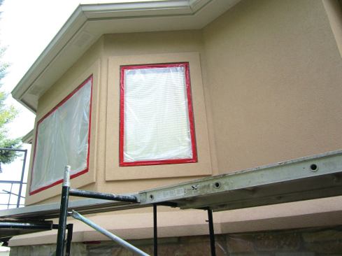 An acrylic latex is used to finish off the stucco.