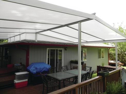 To keep water from splashing off the house roof and down onto the deck, this patio cover has optional fill panels, which can be removed for maintenance.