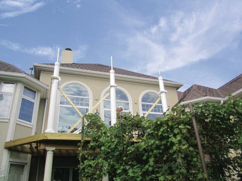 A steel plate welded to the base of each column allows it to be bolted to the deck framing.