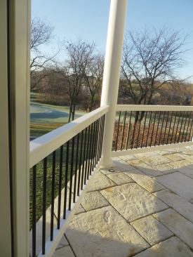 Stone pavers are a surprising finish on an elevated deck.