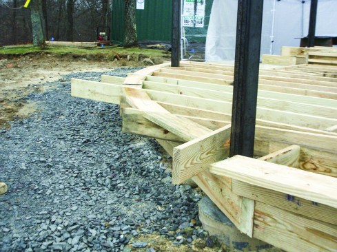 Figure 7. Where the joists would run nearly tangent to the edge of the deck, their supporting beam had to run as close to the deck’s outer edge as possible.
