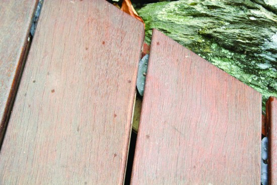 Decking installed green has shrunk to the point where its concealed fasteners have almost disengaged.