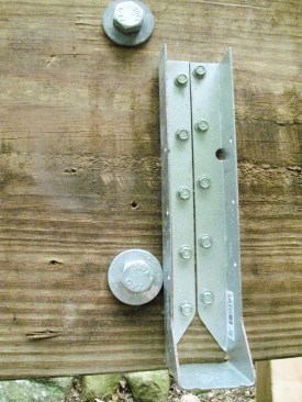 Figure 6. Concealed-flange hangers can save the day when the joist layout falls next to a ledger bolt. 