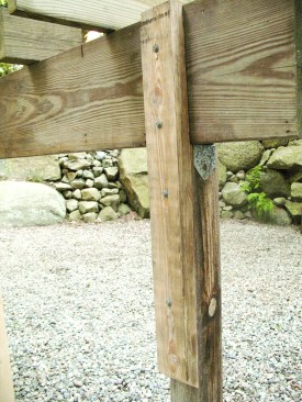 Figure 11. On retro­fits, bolting or screwing a 2-by to the back of the post and beam braces the connection. 