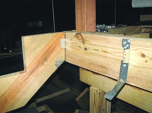 Figure 14. Specifically designed stringer hardware provides a reliable connection to an often under-built attachment. Mount the hardware with structural screws. Nails here would be placed in withdrawal, which is prohibited in the IRC.