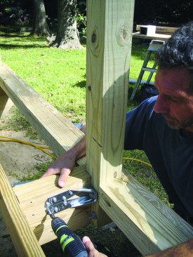 Figure 15. Hardware similar to seismic hold-downs provides a reliable newel connection that’s described in a report from the ICC-Evaluation Service. 