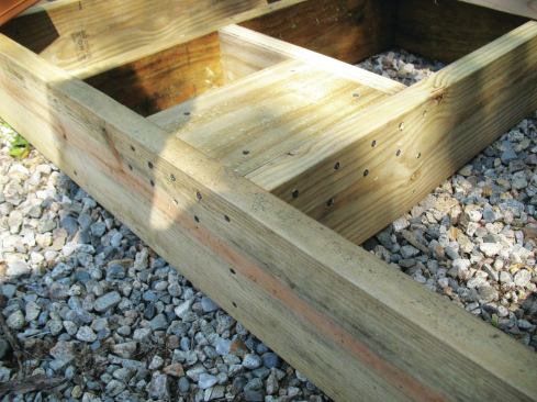 The strongest blocking runs perpendicular to the rim joist. It’s best to align the blocks with a nearby joist for extra stiffness and add a solid block between the rim and first inboard joist at the ends of the deck.