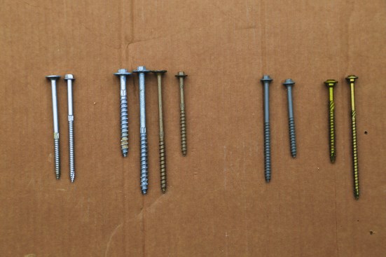 Proprietary structural screws don’t require predrilled holes and have a wider positioning range through the ledger, rim joist, and even the mudsill or wall plate. Pictured (from left to right): 1. Mitek WSW Pro Series washer head and hex head exterior screws; 2. Simpson Strong-Tie SDWH HDG (short and long) screws, coated SDWS, and coated SDWH Timber-Hex screws; 3. FastenMaster LedgerLok (long and short) screws; 4. GRK RSS (short and long) screws.