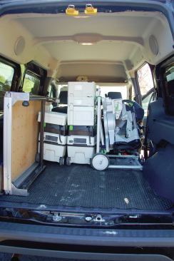 With the saw mounted and the wings removed, the folded stand occupies minimal space in his Ford Transit van.