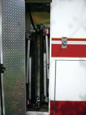 Folded up, the stands easily fit into his work-truck compartment.