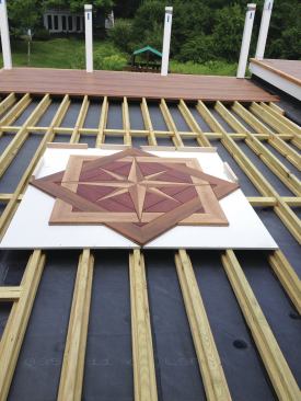 The homeowners selected this 6x6-foot inlay kit. Installing it flush required routing 1/2 inch from the tops of the joists underneath to account for the thickness of its PVC backerboard.