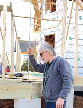 The half-inch threaded rods spanned from foundation pier to the pressure-treated 2x10 header beams of the Queen of Zero porch construction. 