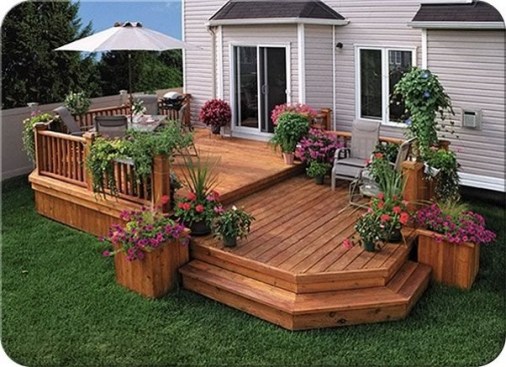 Sure, it looks nice...but dividing this small deck into two separate spaces with an awkward step makes it less functional, especially when traffic flows right through both areas.