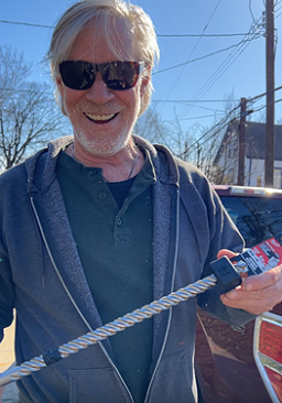 Queen of Zero Site Supervisor Matt Kulp marks the 18-inch drill bit with black electrical tape for the correct 12-inch embedment of threaded uplift support rods.