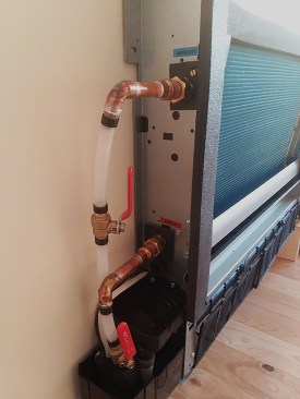 A low-temperature panel radiator, such as the Mestek thinwall heating/cooling fan coil shown at left, is another distribution option that is both more efficient and more responsive than a traditional fin-tube radiator.