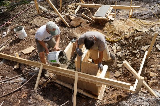 The crew places concrete and frames up stemwalls.