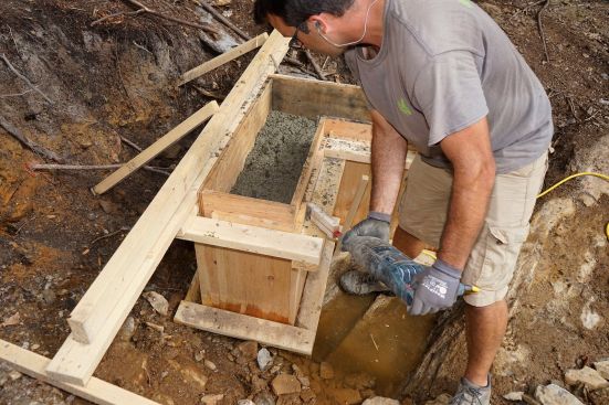 The crew places concrete and frames up stemwalls.