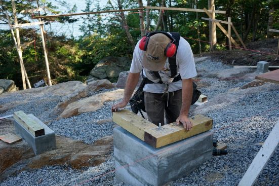 The crew places concrete and frames up stemwalls.