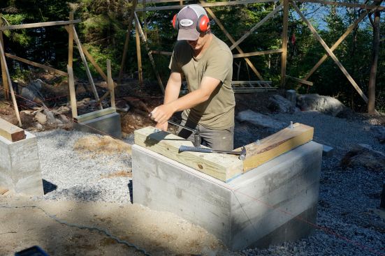 The crew places concrete and frames up stemwalls.
