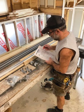 A pocket-door kit typically includes a frame header assembly, split steel studs, door hangers, and all other components needed to assemble the frame. The author carefully reviews the installation instructions and parts list prior to every installation.