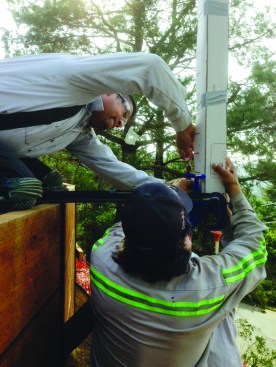 The prefabricated guard-post assemblies were temporarily clamped in place, then welded to the columns.