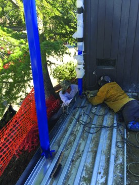 A pour stop of 1/4-inch-by-6-inch steel welded to the posts forms the edge of the slab.