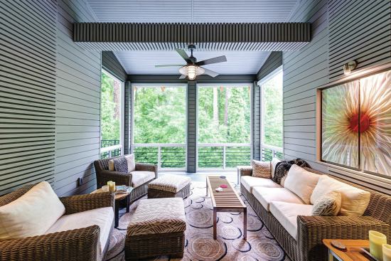 The screened end of the porch offers air circulation and a connection to the outdoors. The screen panel on the left side is a door that opens out onto the deck.