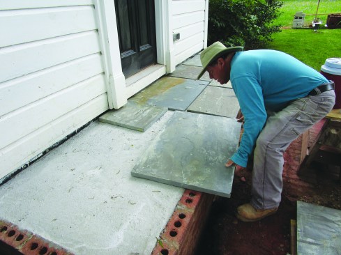 The author dry-fit the bluestone pavers, numbering them to keep track of their location.