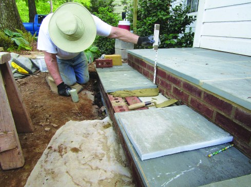 The pavers were set in a thick bed of type S mortar. After the mortar bed cured, he grouted the 1/2-inch-wide joints with the same type S mortar.