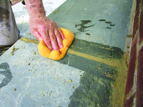 He cleaned up the joints afterward with a damp sponge.