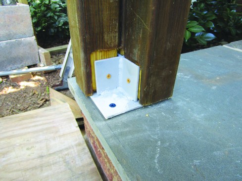Each column consists of four 3x3 posts connected via the brackets to the masonry stoop ...