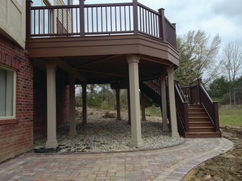 Clad support columns that have been stained to match the trim on the rest of the house look more substantial than bare 6x6 PT posts and do a better job of visually anchoring a tall deck to the ground. 