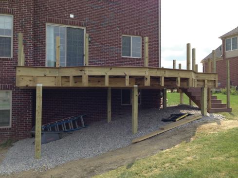 Drop blocks were added to the cantilevered section of this deck to support tiered trim that will be used to finish the fascia.