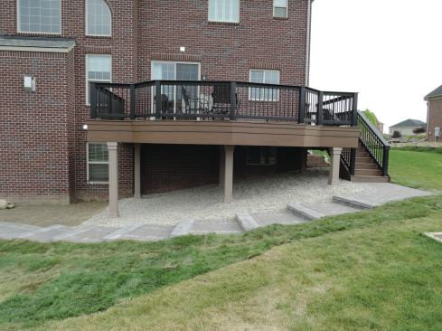 With finished support columns and tiered fascia, this raised deck looks good from the ground level.